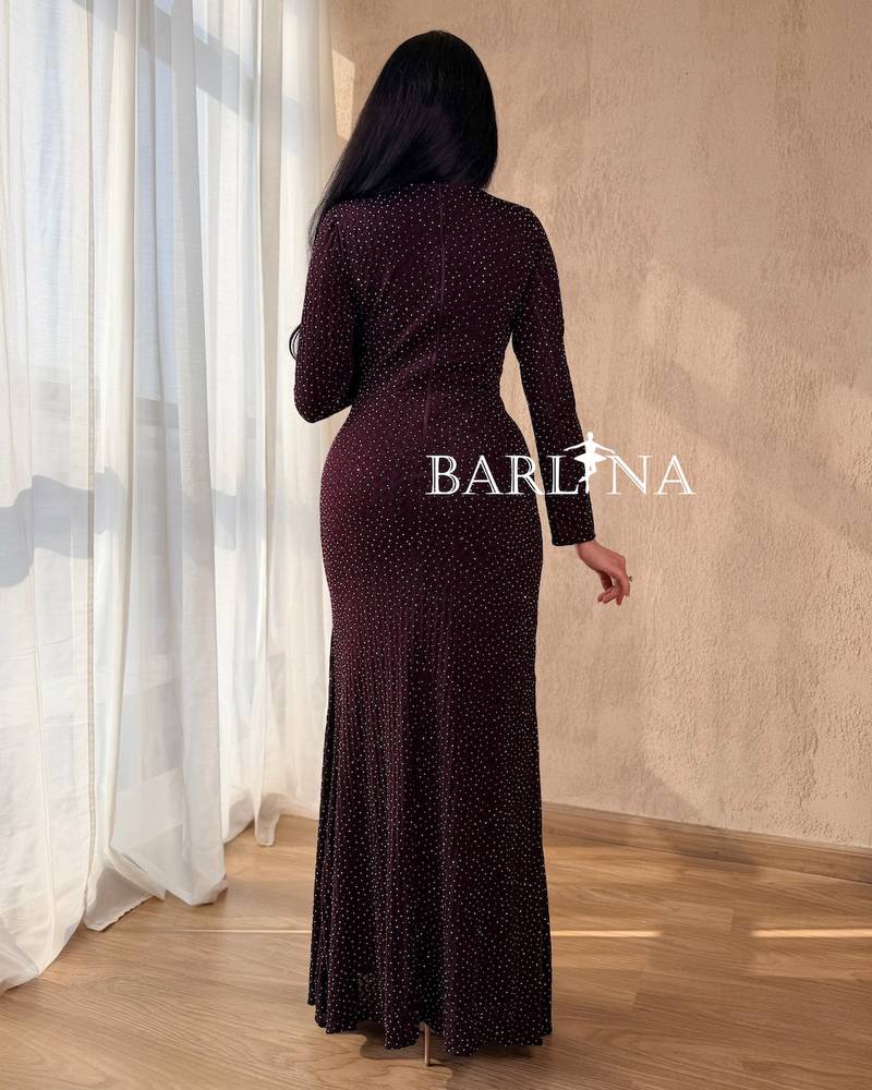 A dark burgundy dress studded with small sequins