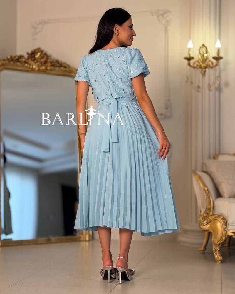 Sky blue pleated dress with short puffed sleeves