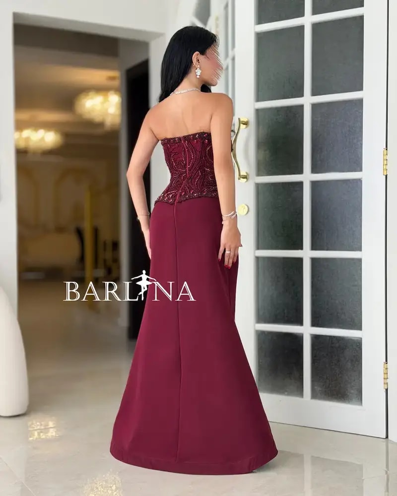 Burgundy evening dress with an embroidered corset design