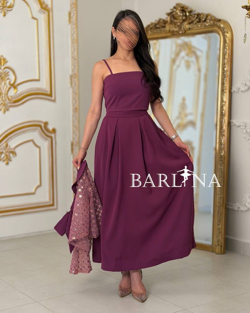 Soft fuchsia embroidered set adorned with a bow