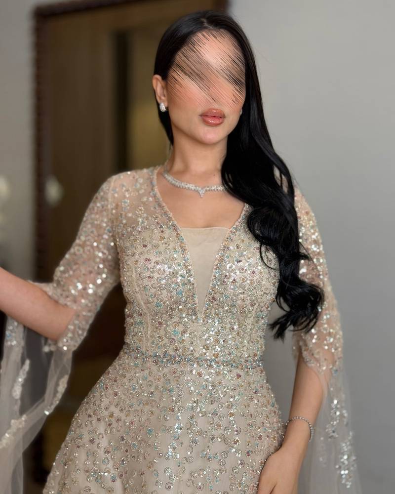 Beige evening dress with sheer draped sleeves