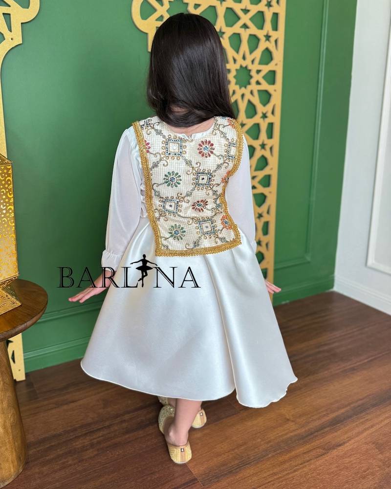 White girl's dress with a fully embroidered bodice