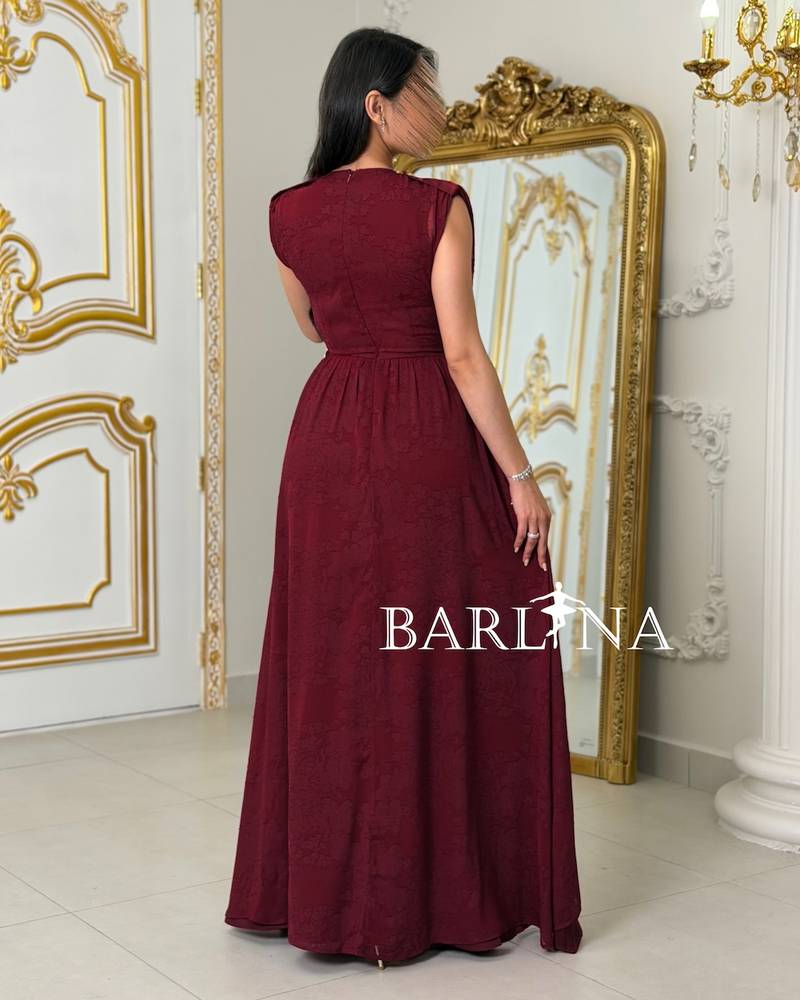 Red dress with a fitted waist and pleats