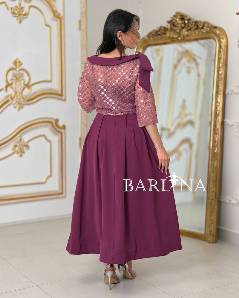 Soft fuchsia embroidered set adorned with a bow