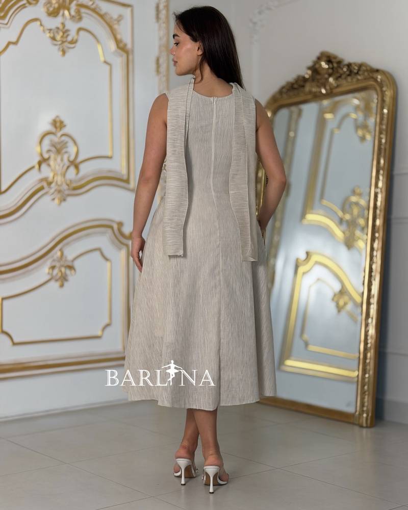 Beige V-neck dress with black embroidery