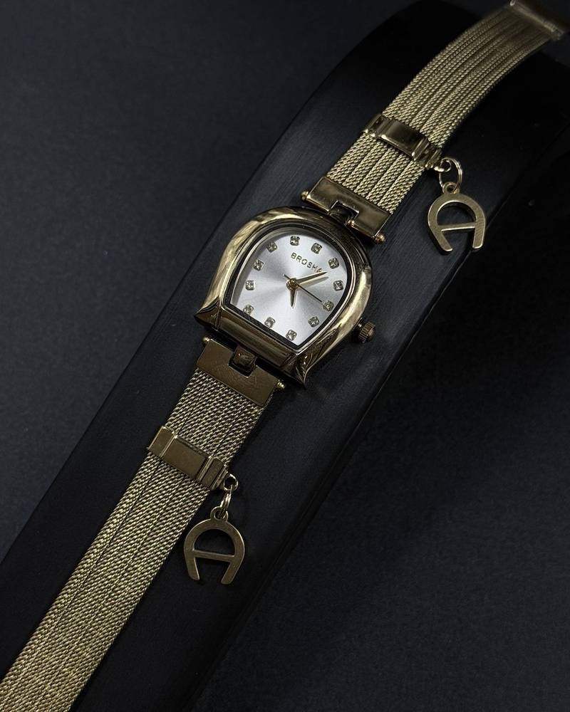Elegant women's watch adorned with a charm