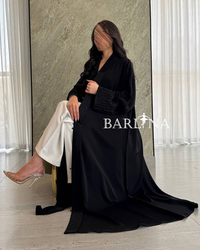 Black abaya embroidered with a royal touch