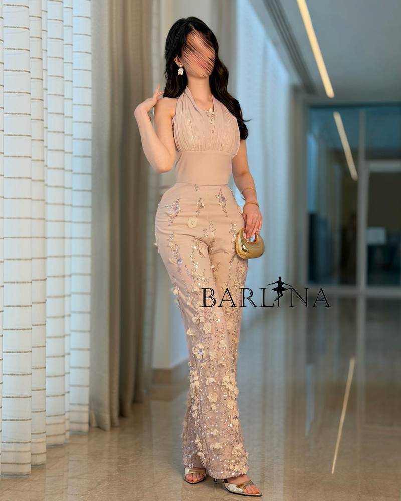 Luxurious beige jumpsuit embroidered with roses and sequins