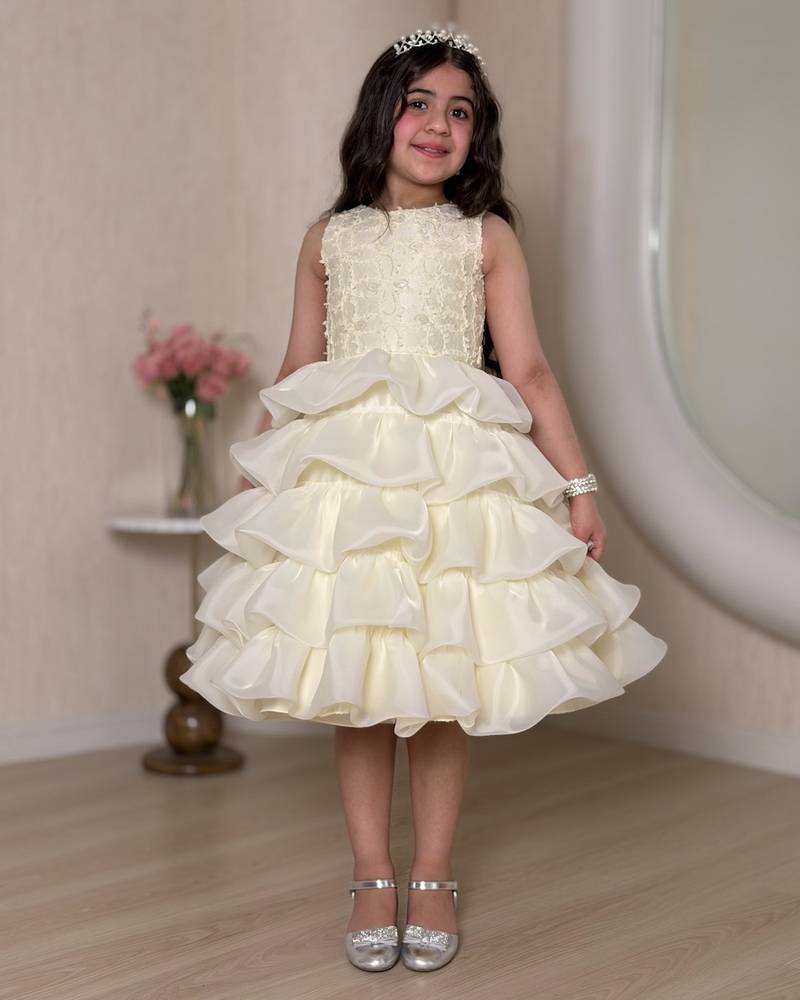 Ivory girls' dress with multiple ruffle layers