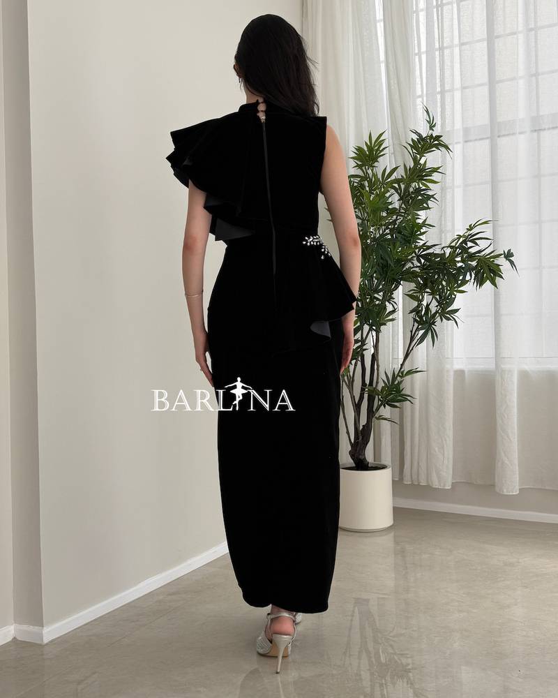 Black velvet dress with embroidered side details