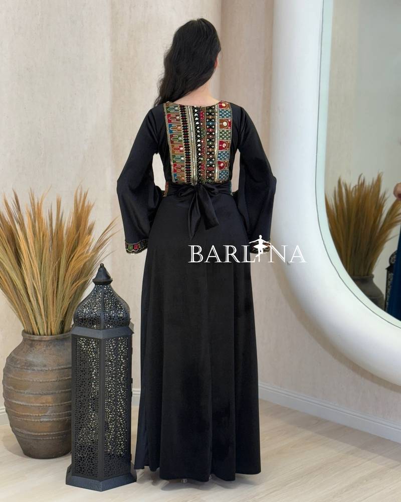 Black jalabiya embroidered with colorful patterns