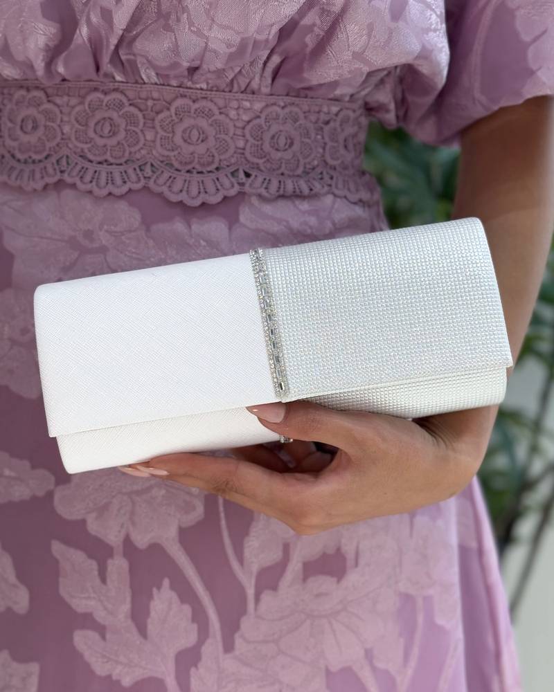 Evening bag decorated with a studded ribbon in the middle