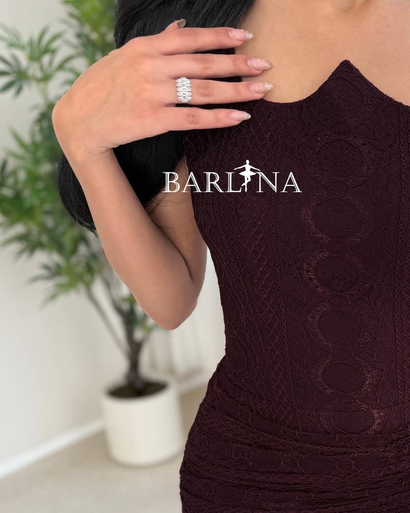 A luxurious burgundy draped lace dress
