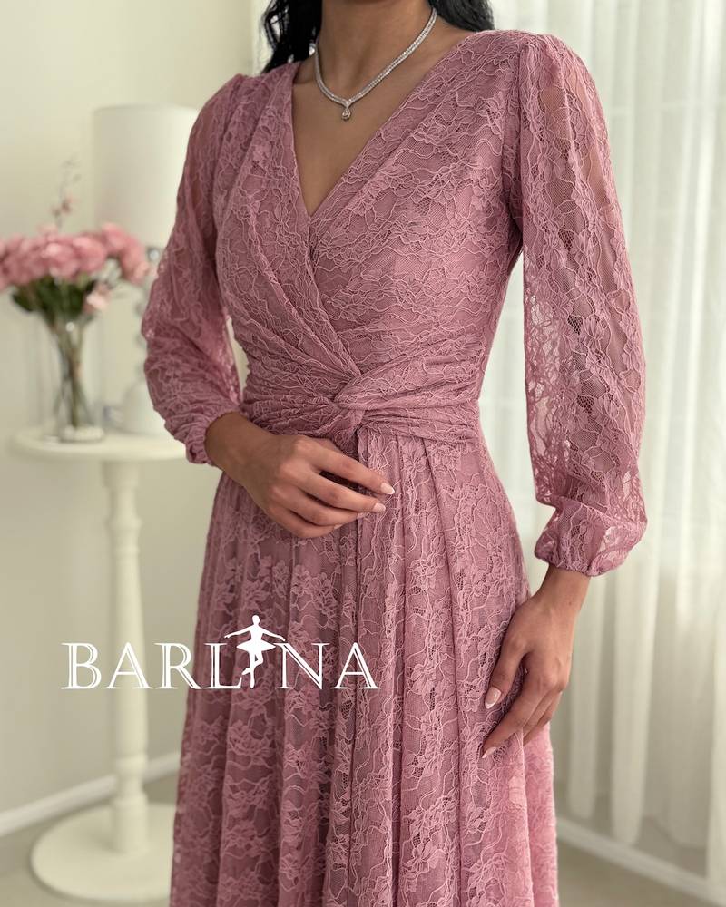 Pink lace dress with a crisscross wrap design