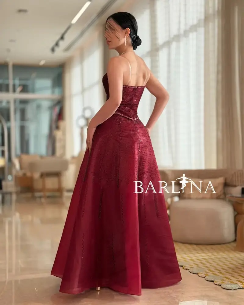 Burgundy puffy evening dress with a corset design
