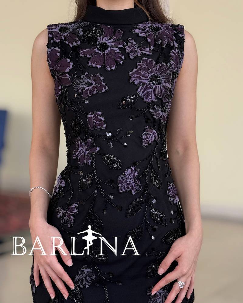 Elegant black dress with delicate purple embroidery