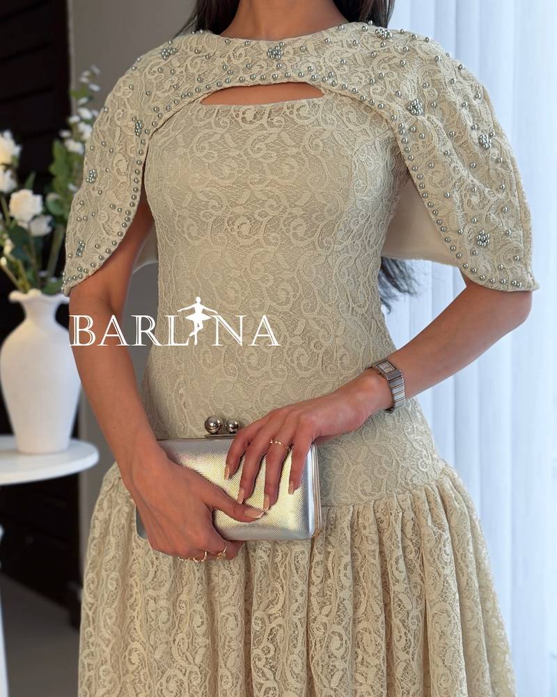 Beige lace dress adorned with pearls