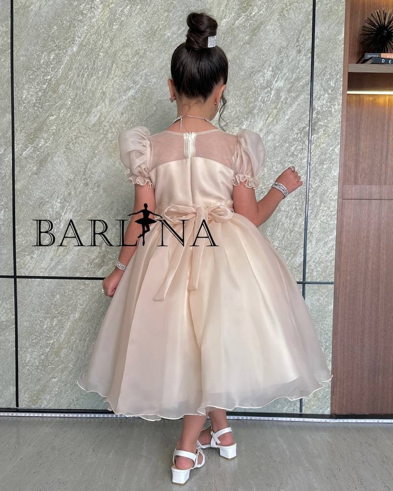 Girls' beige dress with flowing prominent flowers