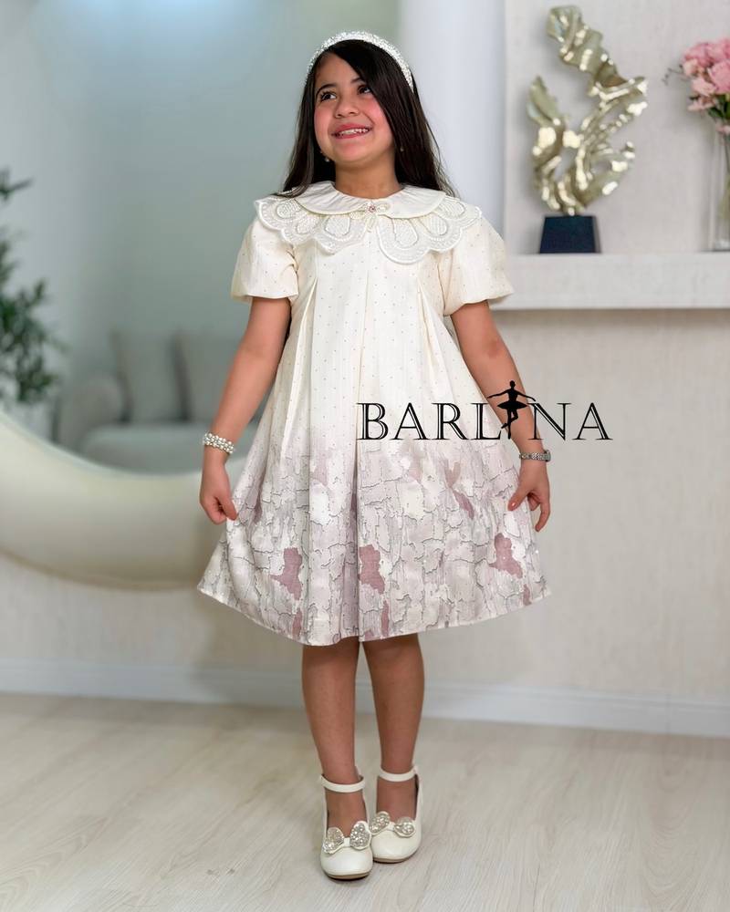 A short girl's dress decorated with delicate embroidery