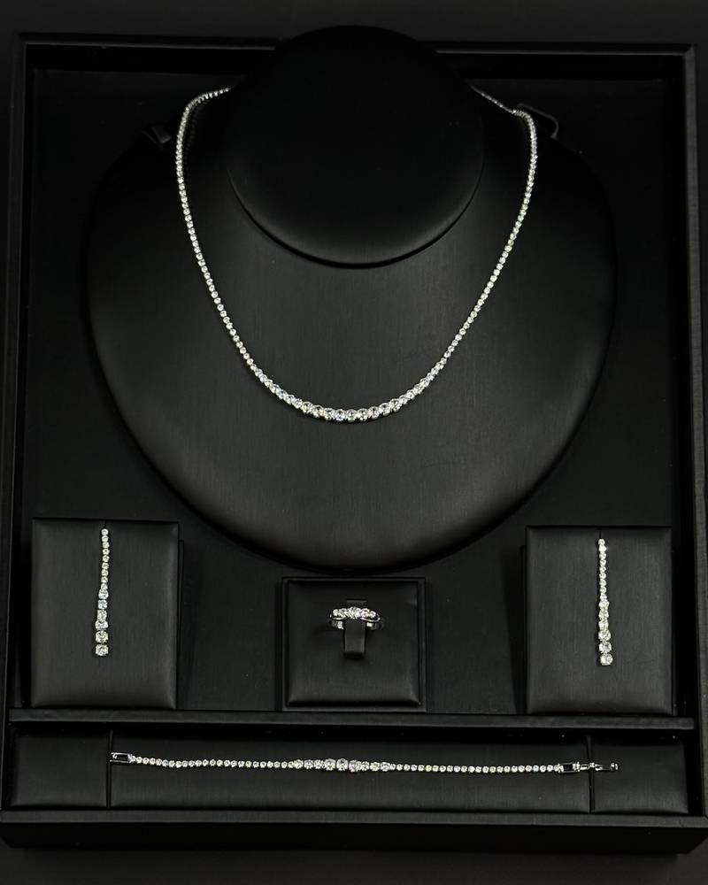 Accessory set studded with round stones