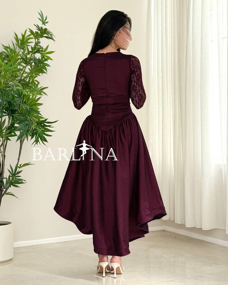 A burgundy dress featuring an elegant corset cut