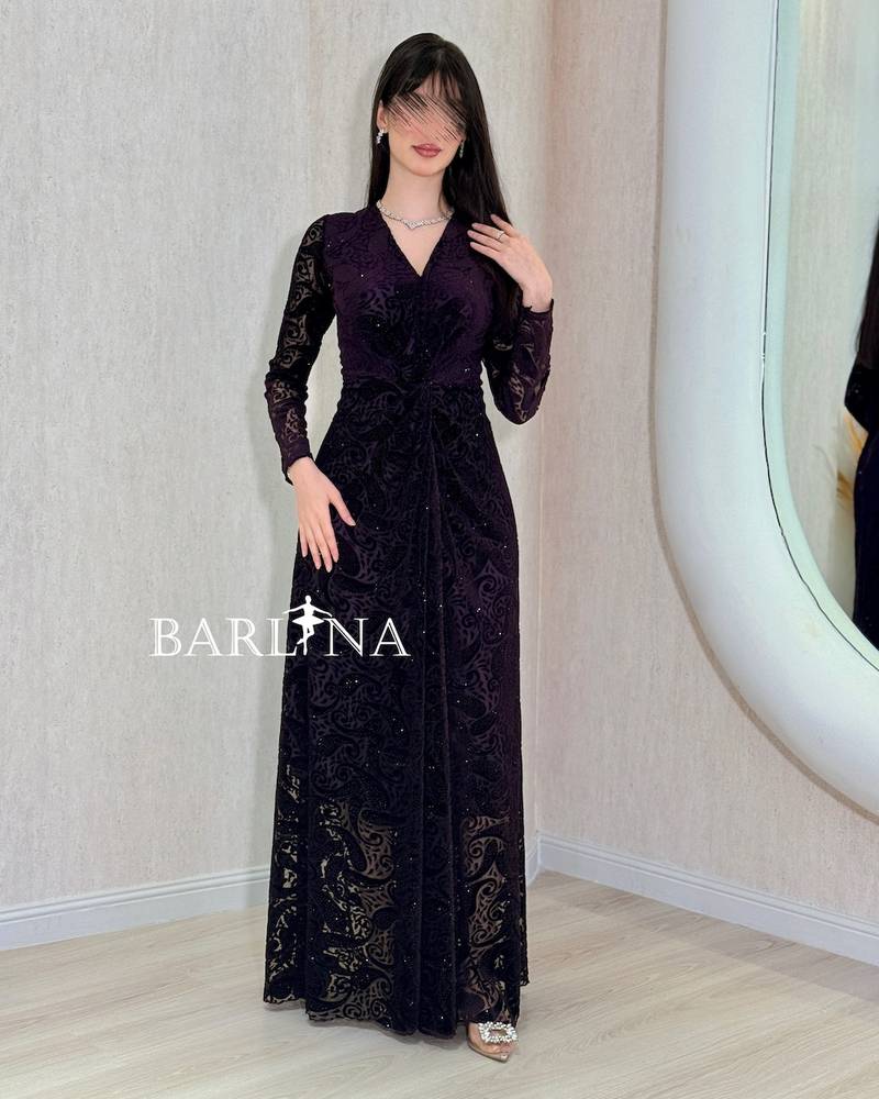 Dark purple dress with sheer patterned sleeves