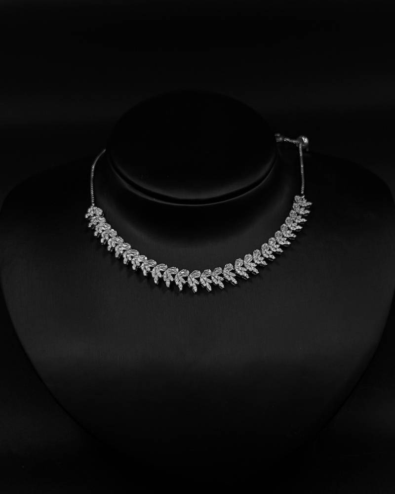 Accessory set with a cascading leaf-design necklace