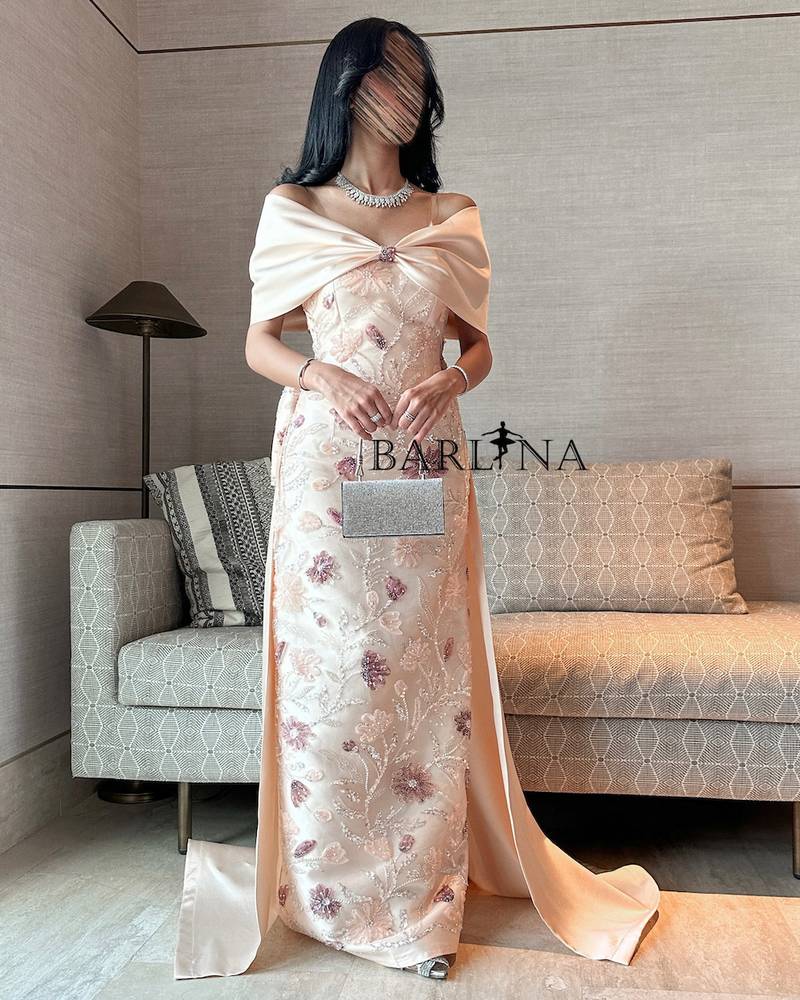 Cream evening dress with an elegant back bow