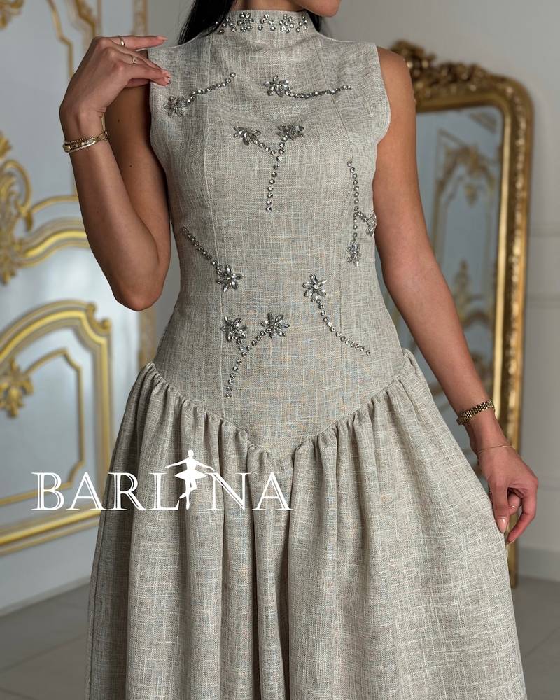 Beige fitted dress adorned with crystals