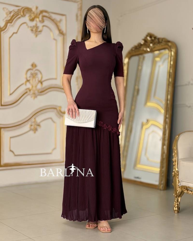 Burgundy pleated dress adorned with roses
