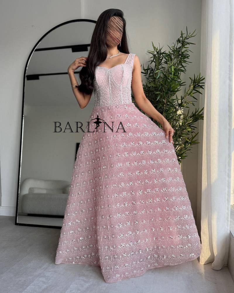Pink dress embroidered with shimmering silver details