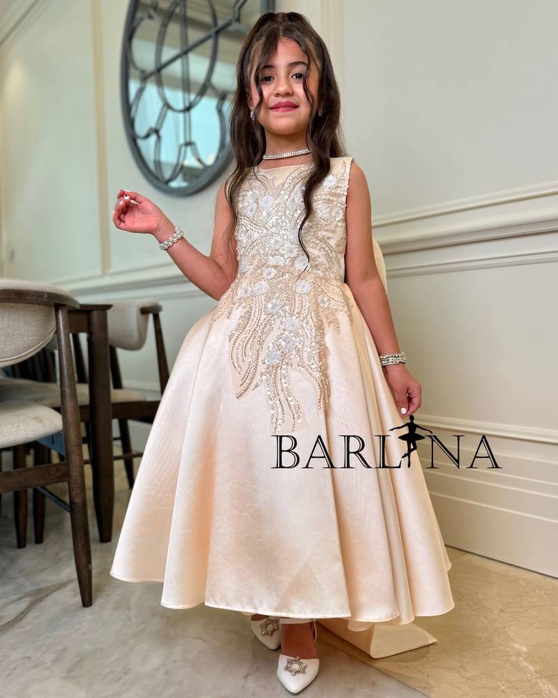 Girls' dress with a long train and an open back