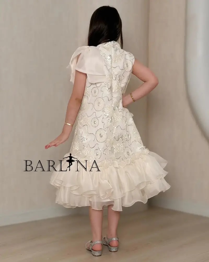 Girls' embroidered dress with ruffles at the bottom