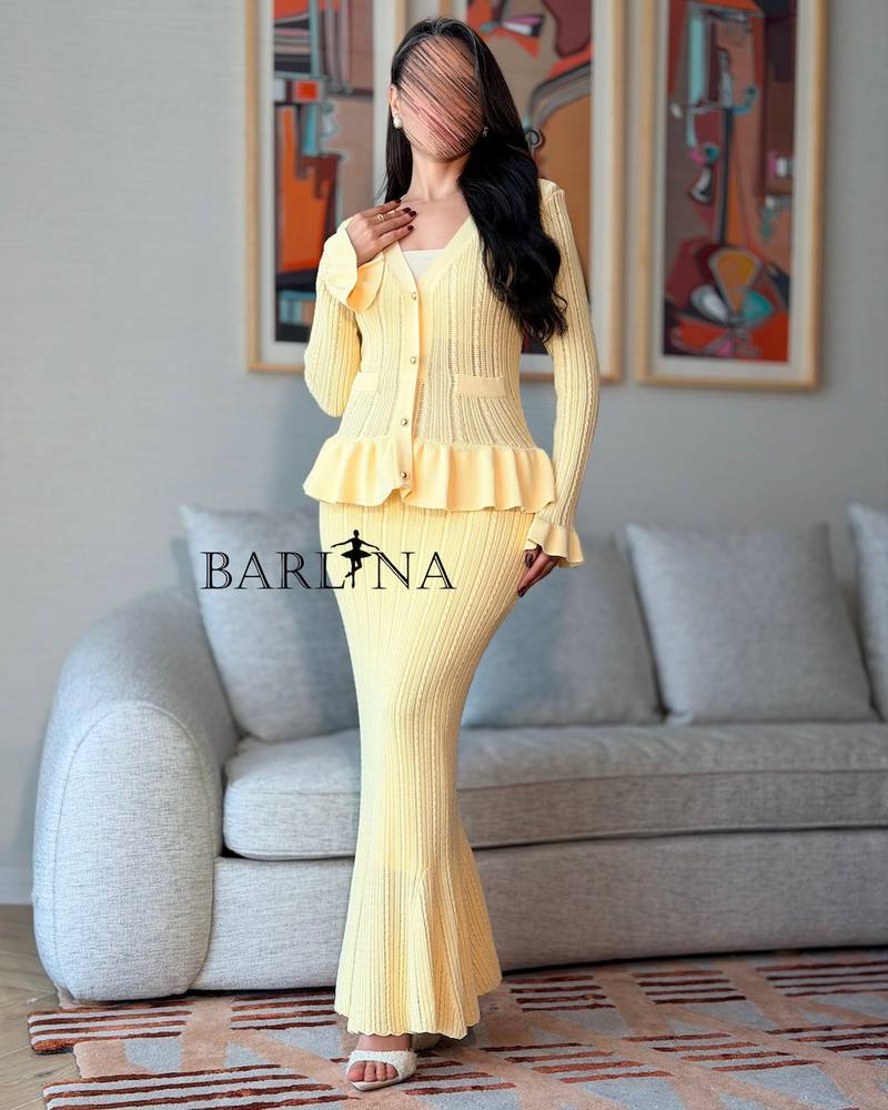Yellow knitted dress with subtle pleats at the waist