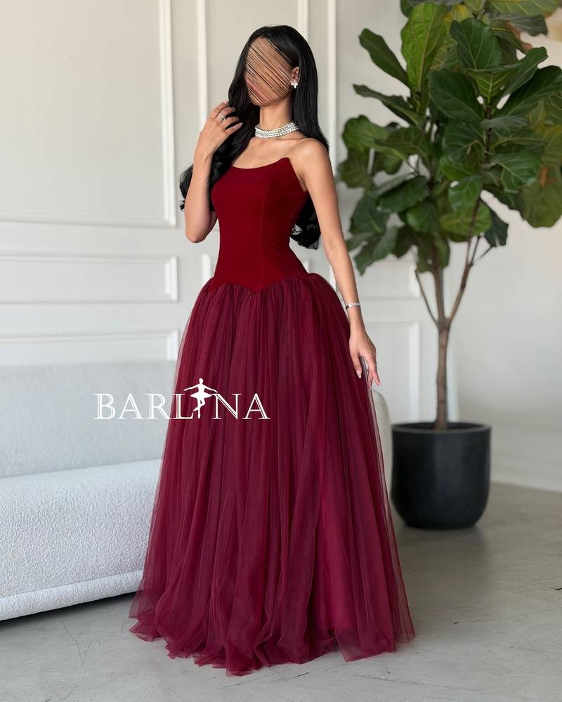 A burgundy puffy dress with a simple corset