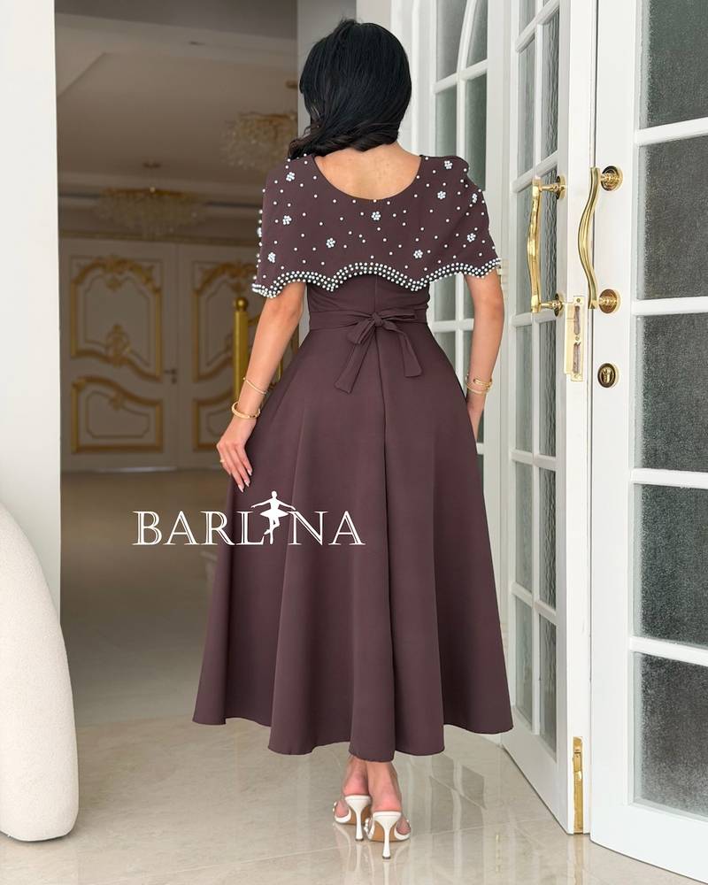Brown dress with a crystal-embellished off-the-shoulder piece