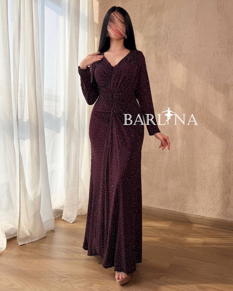 A dark burgundy dress studded with small sequins