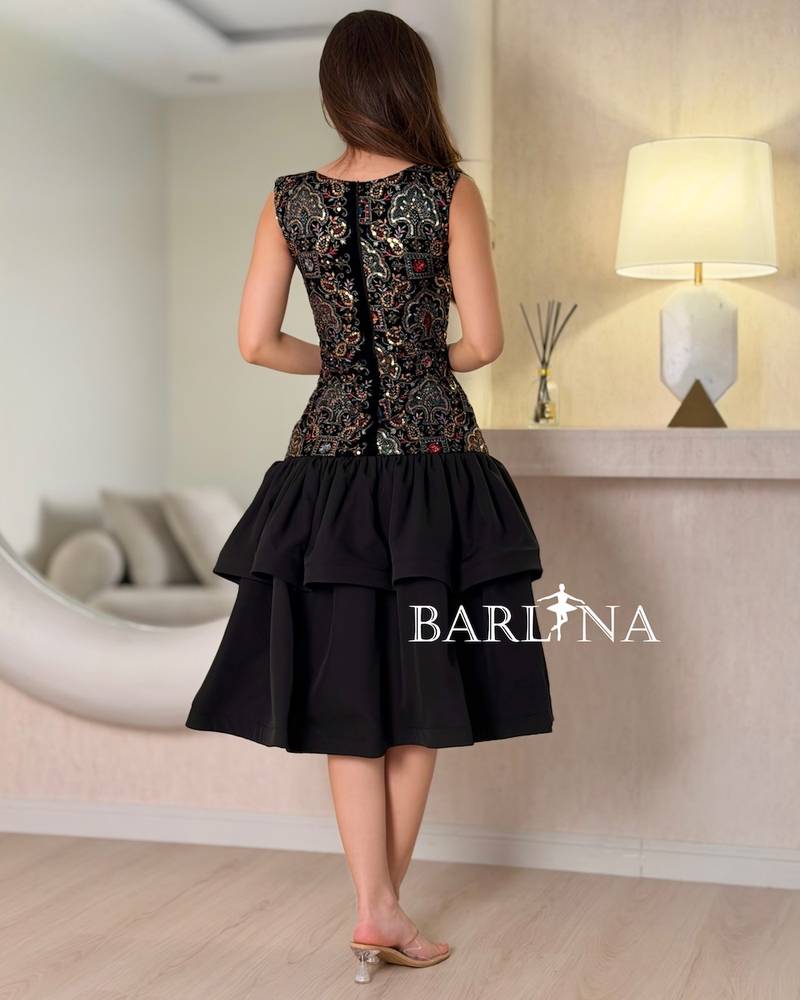 A soft dress with layers and embroidery on the top