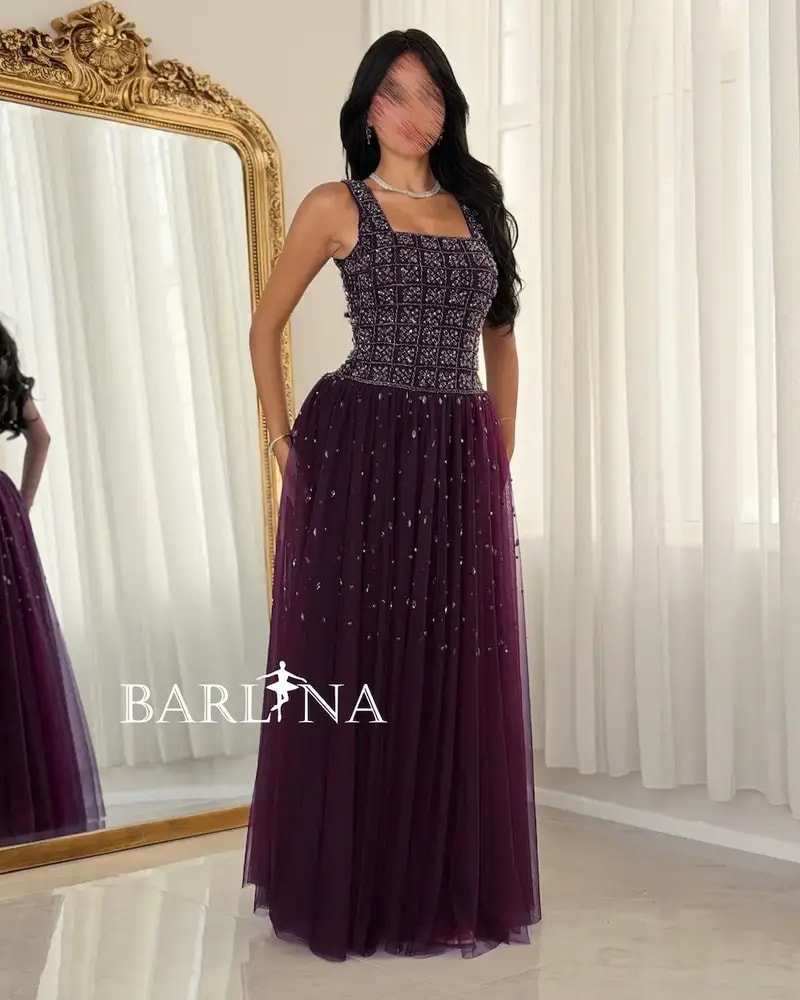 Purple evening dress with elegant embroidery on the top