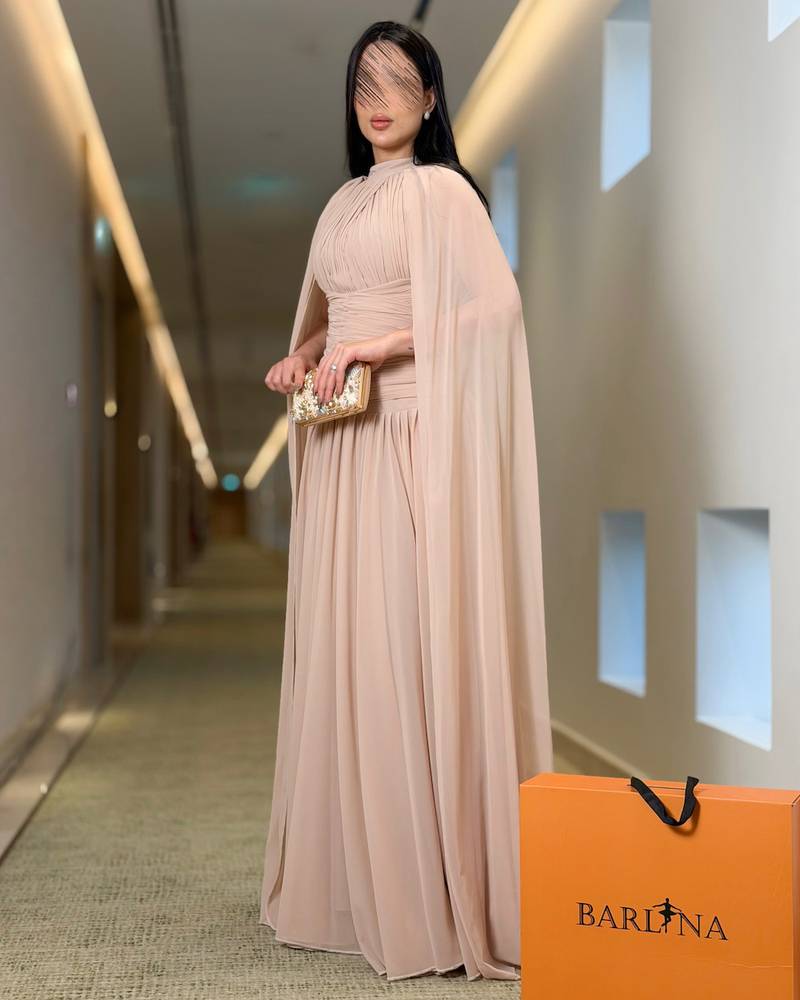 Beige evening dress with chiffon cape and draped cut