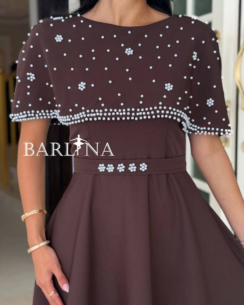 Brown dress with a crystal-embellished off-the-shoulder piece