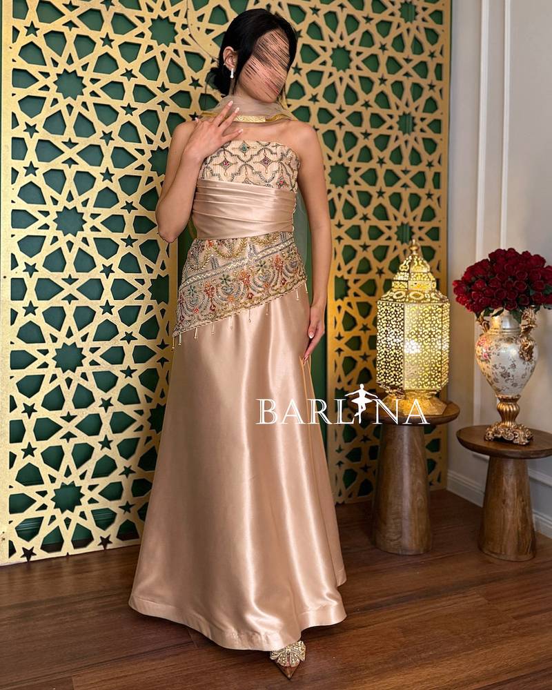 Gold evening dress with luxurious oriental embroidery