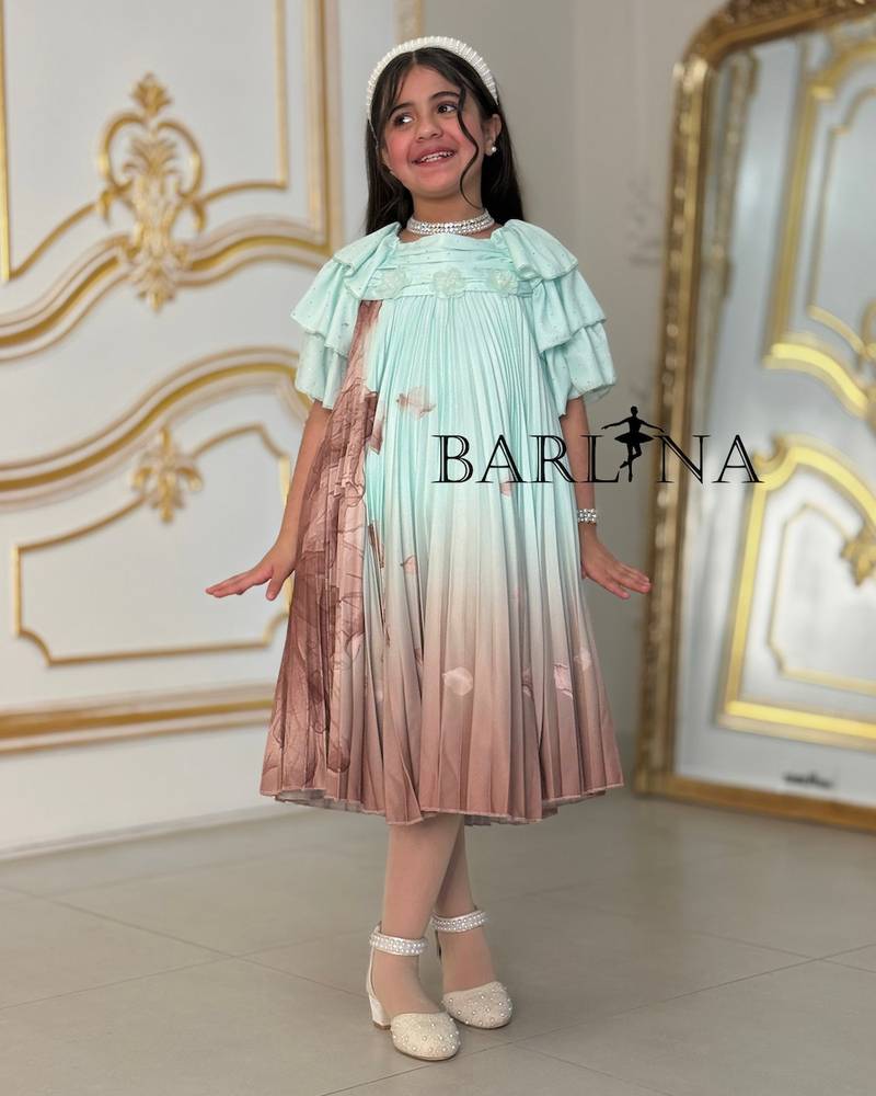 A soft girl's dress decorated with delicate prints