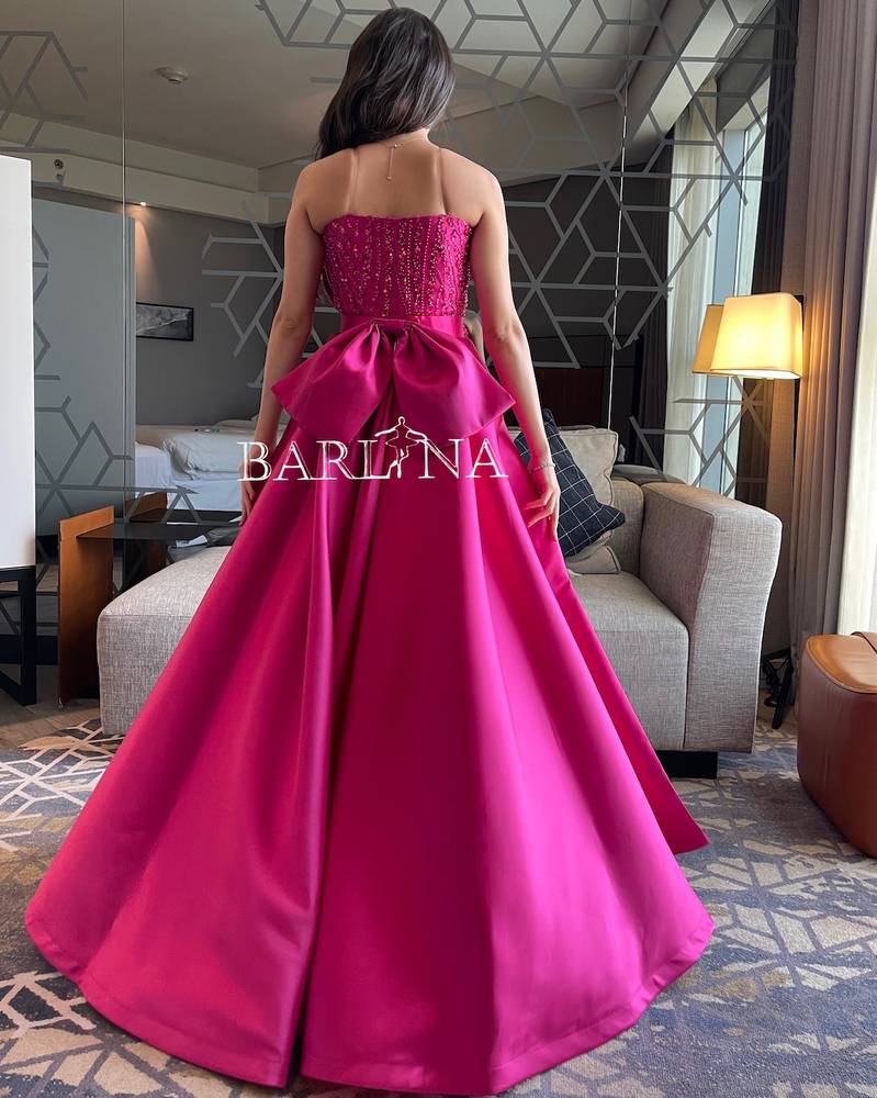 Fuchsia sequin dress with a bow