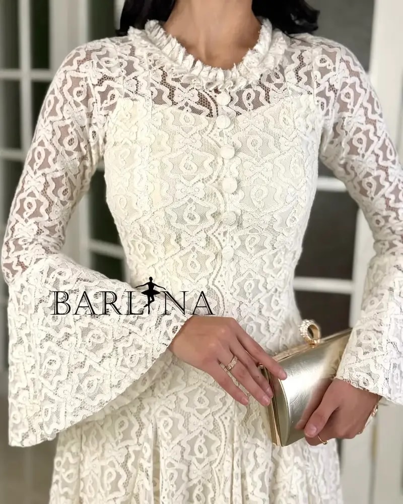 A soft dress adorned with elegant lace patterns