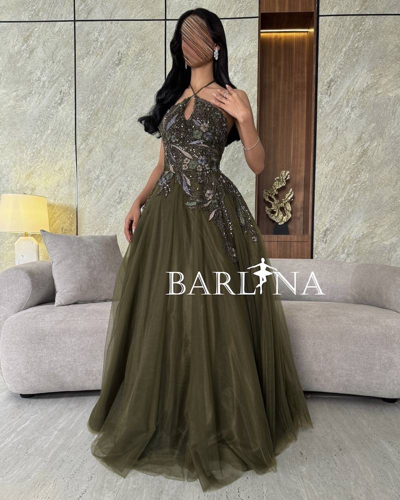 Olive green dress with shiny embroidery and front slit