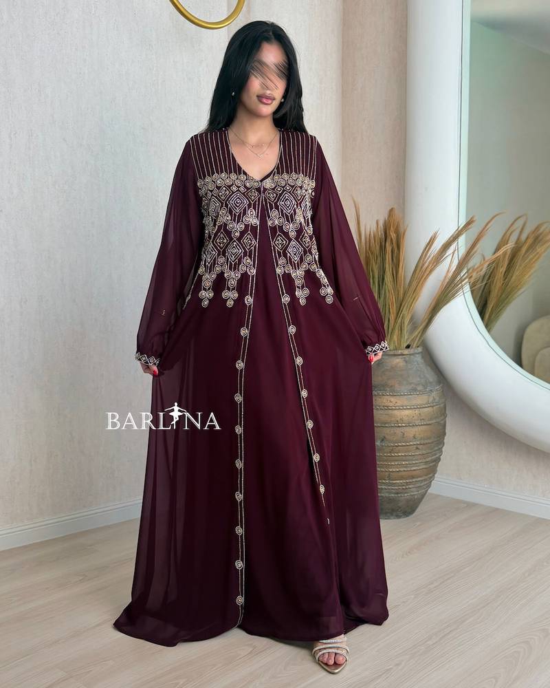 Burgundy jalabiya adorned with delicate embroidery on the chest