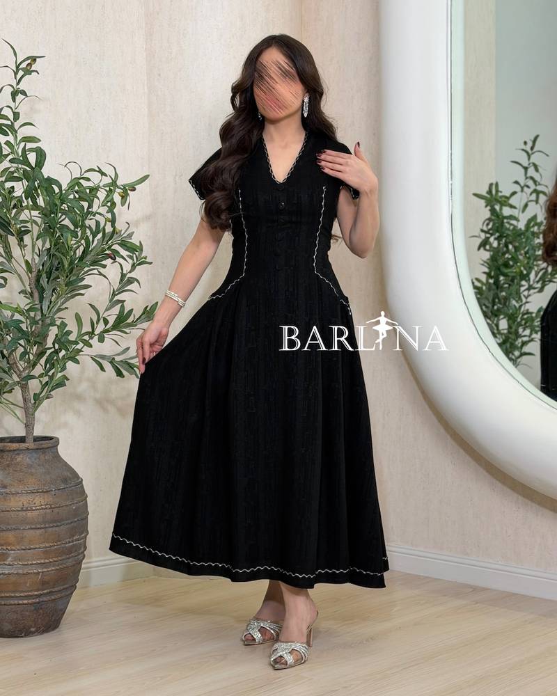 Black dress with front buttons and zigzag embroidery