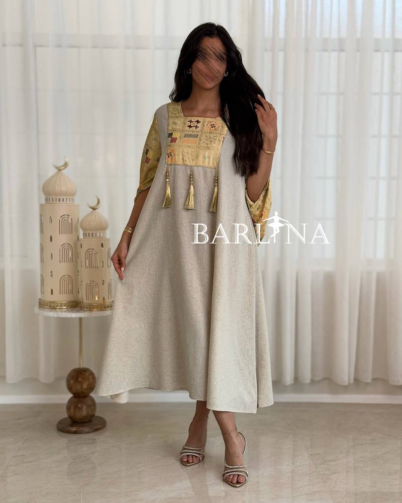 Beige jalabiya with delicate embroidery details at the top