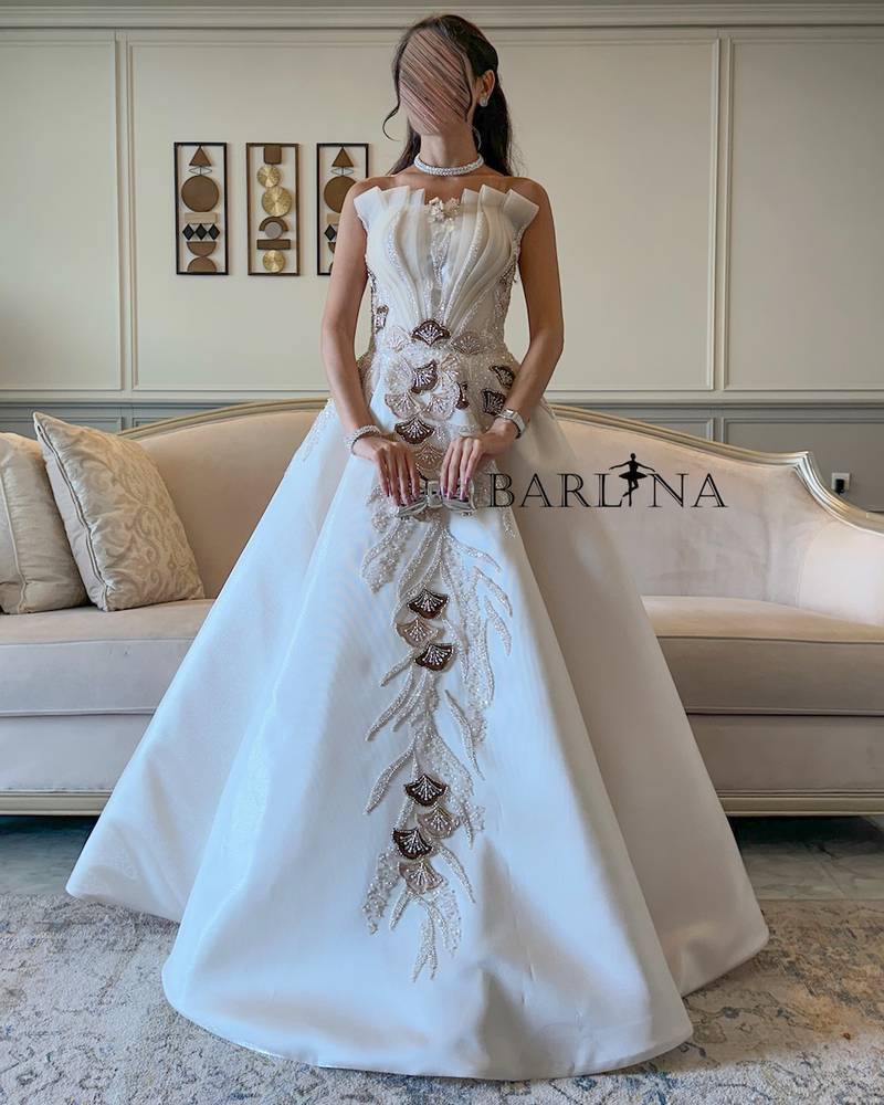 Off white evening dress with brown embellishments
